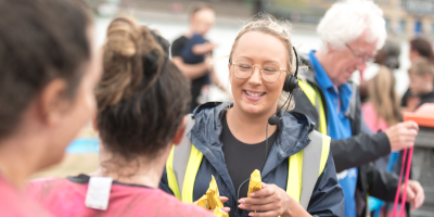 Volunteer at a race for life event smiling